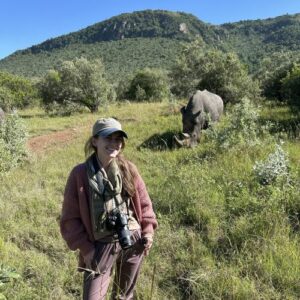 Allie with a rhino in the background
