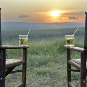 Enjoying a cocktail and a view of a vast expanse in Kenya.