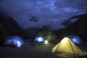 Camping spot with tents at night.