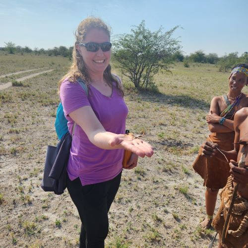 A woman holding a scorpion