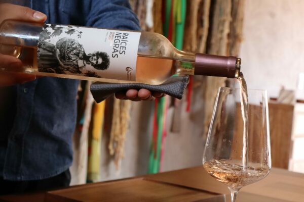 A glass of wine being poured at Mil Restaurant in Peru