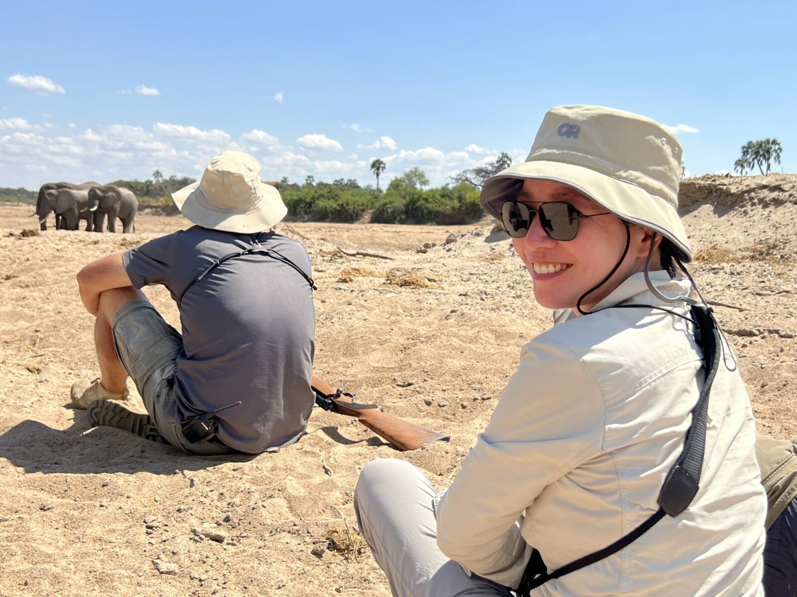 Two people watching elephants in Ruaha National Park in Tanzania.