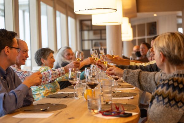 Passengers having dinner aboard a ship.