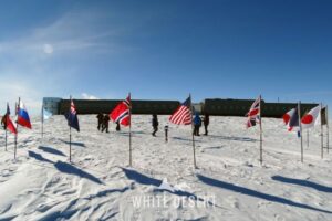 Flags at the geographic South Pole.