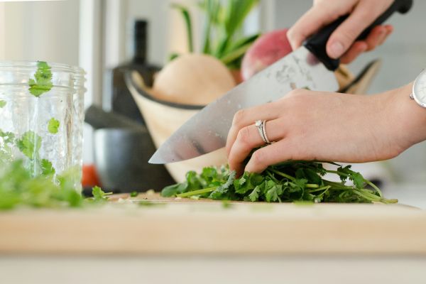 A person chopping vegetables.