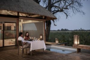 Couple dining by the pool