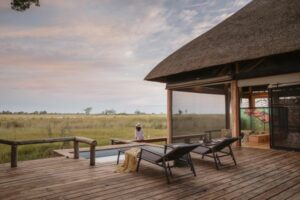 View of a deck and a person overlooking the plains