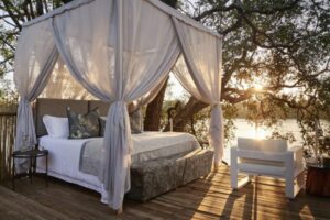 Bed in the Starbed Treehouse Suite at Victoria Falls River Lodge
