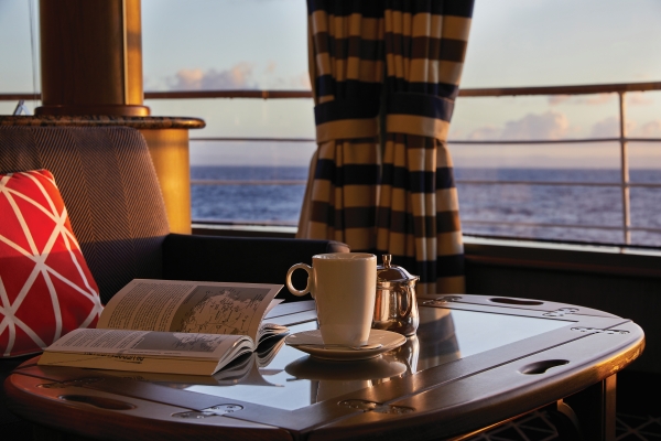 Coffee and a book on the table at the observation lounge.