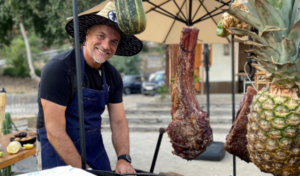 Man smiling at a cooking class in Santiago.