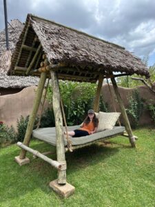Woman on a daybed swing.