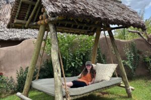 Woman on a daybed swing.