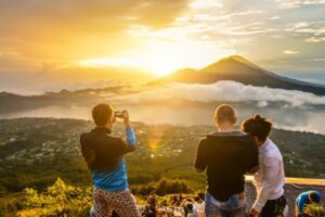People at the summit of Mount Batur watching the sunrise.