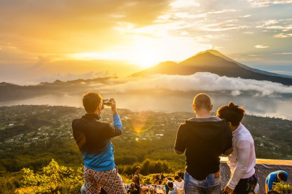 People at the summit of Mount Batur watching the sunrise.