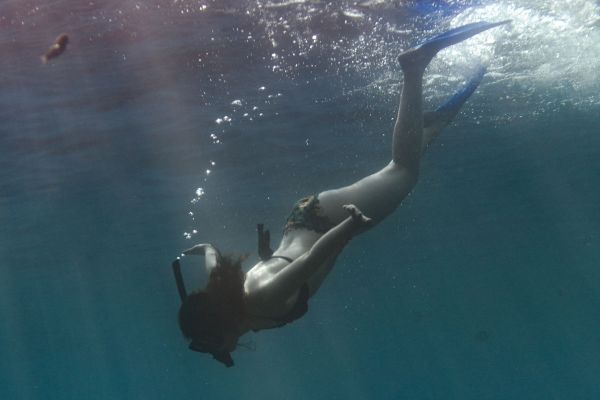 Woman snorkeling in Bali.