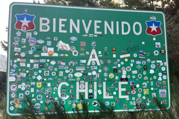 Bienvenido a Chile sign with stickers on it.