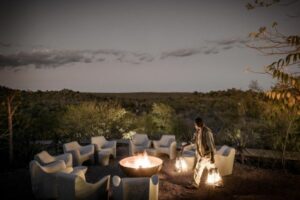 Chairs set up around a fire