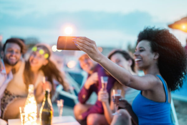 Happy friends taking selfie