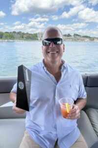 Craig Beal holding World's Best award.