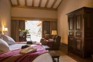 Accommodations with a king bed in the Sacred Valley, Inkaterra Hacienda, Peru