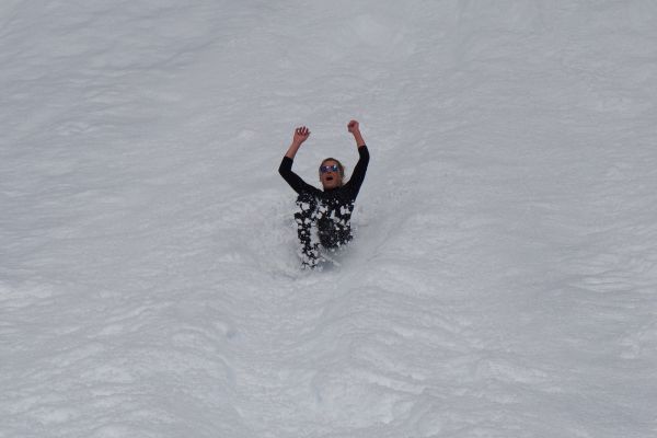 A person body sledding in Antarctica.