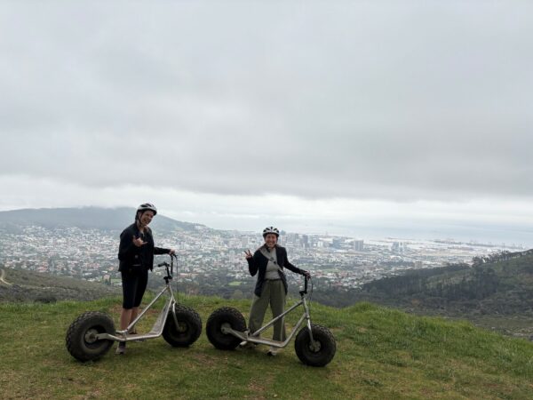 Two female travelers on a lookout over Cape Town.